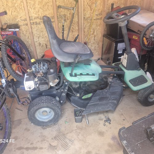 Broken down old family lawn mower left and forgotten trying to bring it back to life used WD-40 to get rusted bolts unstuck and unceased